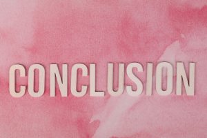 The word 'CONCLUSION' in white letters on a textured pink watercolor background.